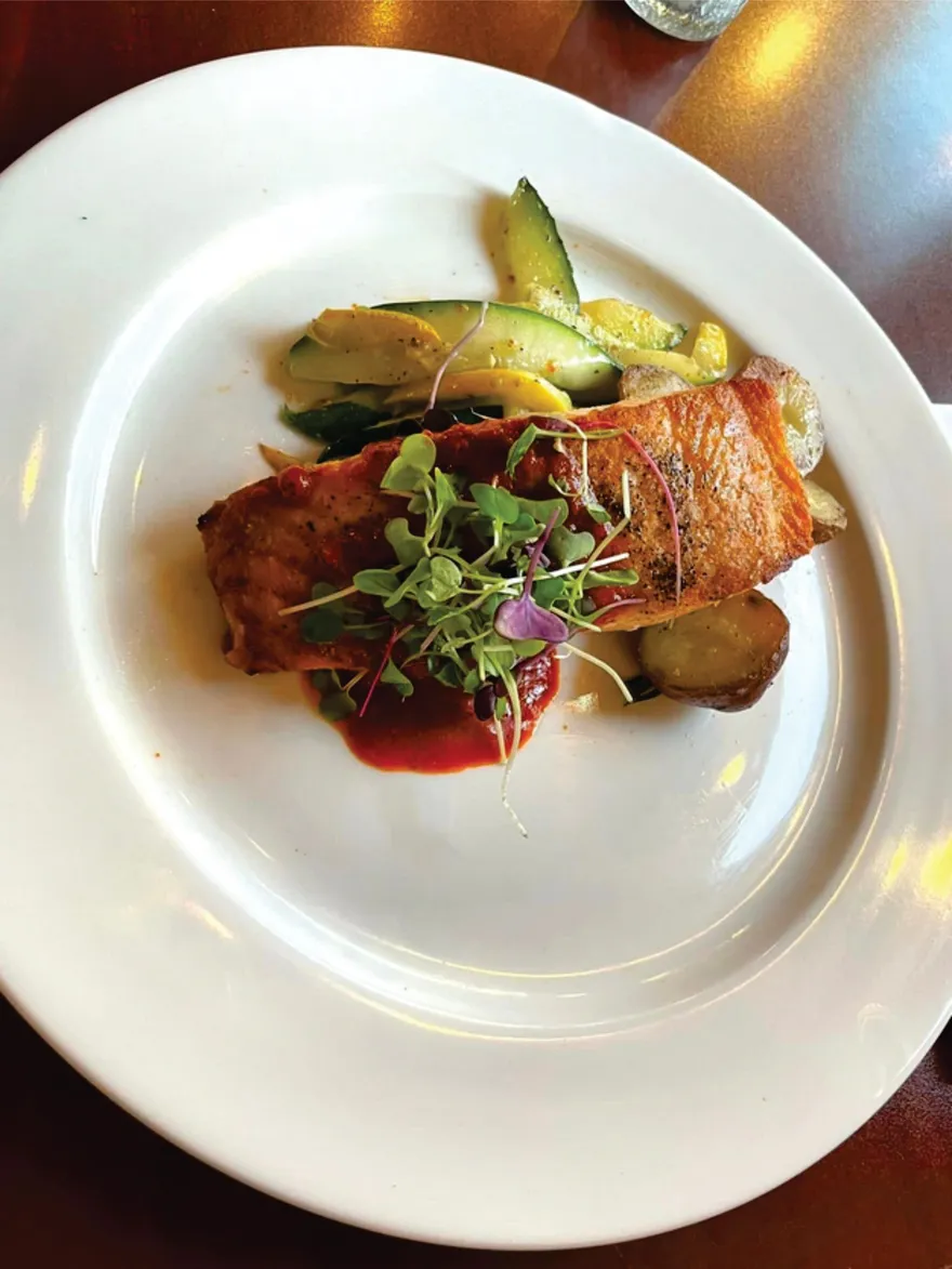 Pan-seared salmon with microgreens and roasted potatoes